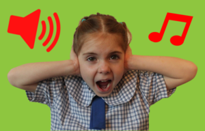 School girl covering ears
